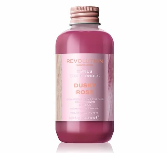 Revolution Dusky Rose hårtoning för blont hår i en lila flaska.